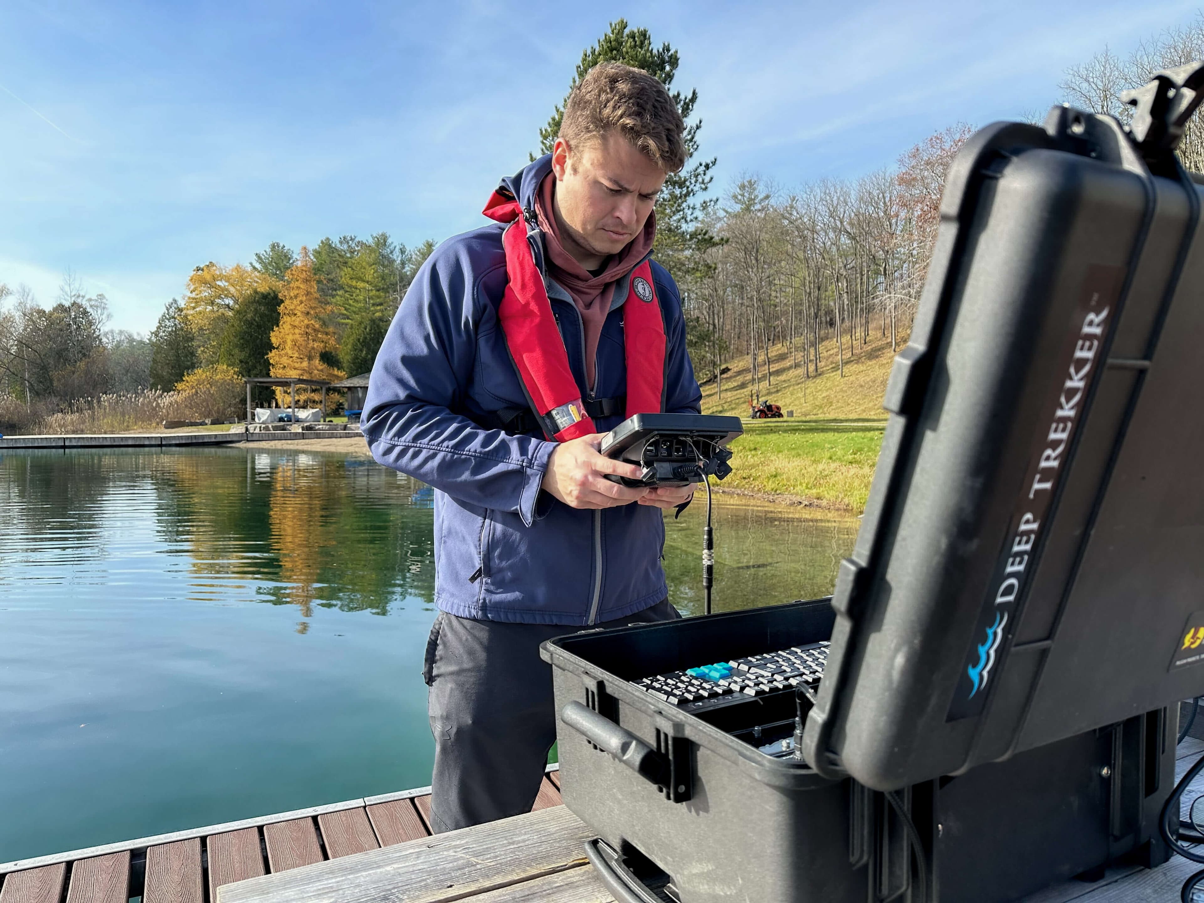 operator looking at handheld controller